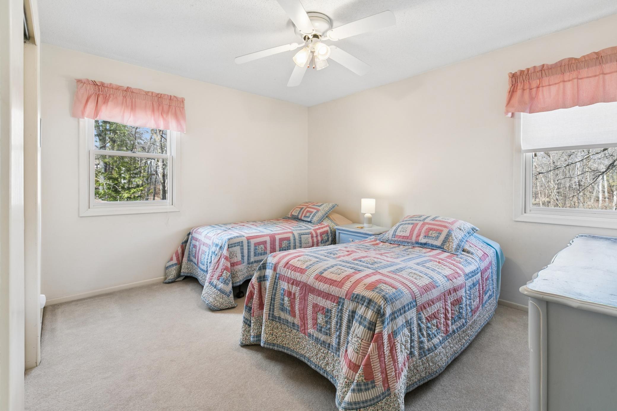 Another spacious bedroom on the main floor with deep closet storage, and corner windows.