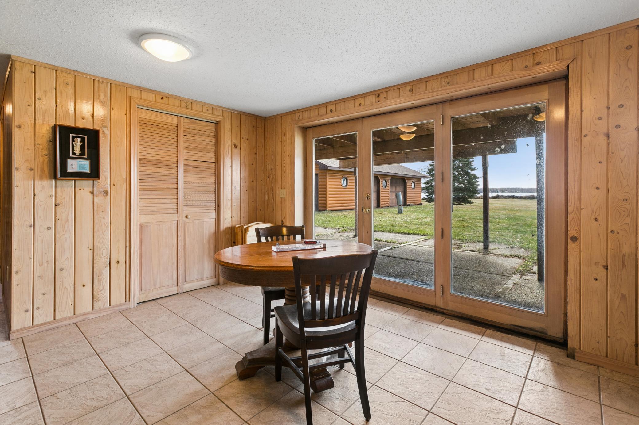 Walk-out to the patio and amazing front lawn.