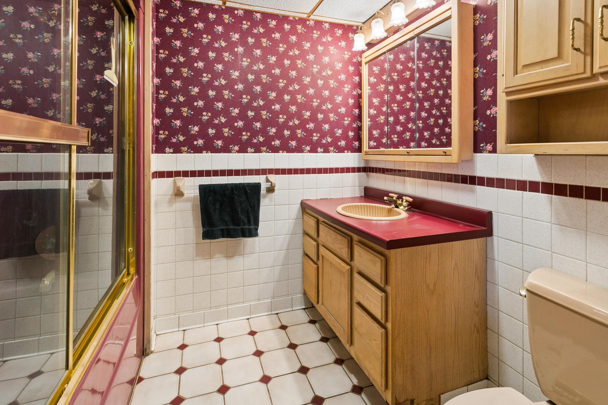 It was "fancy" in it's day! Lower Level fully bath may need refreshing but it's roomy and clean.