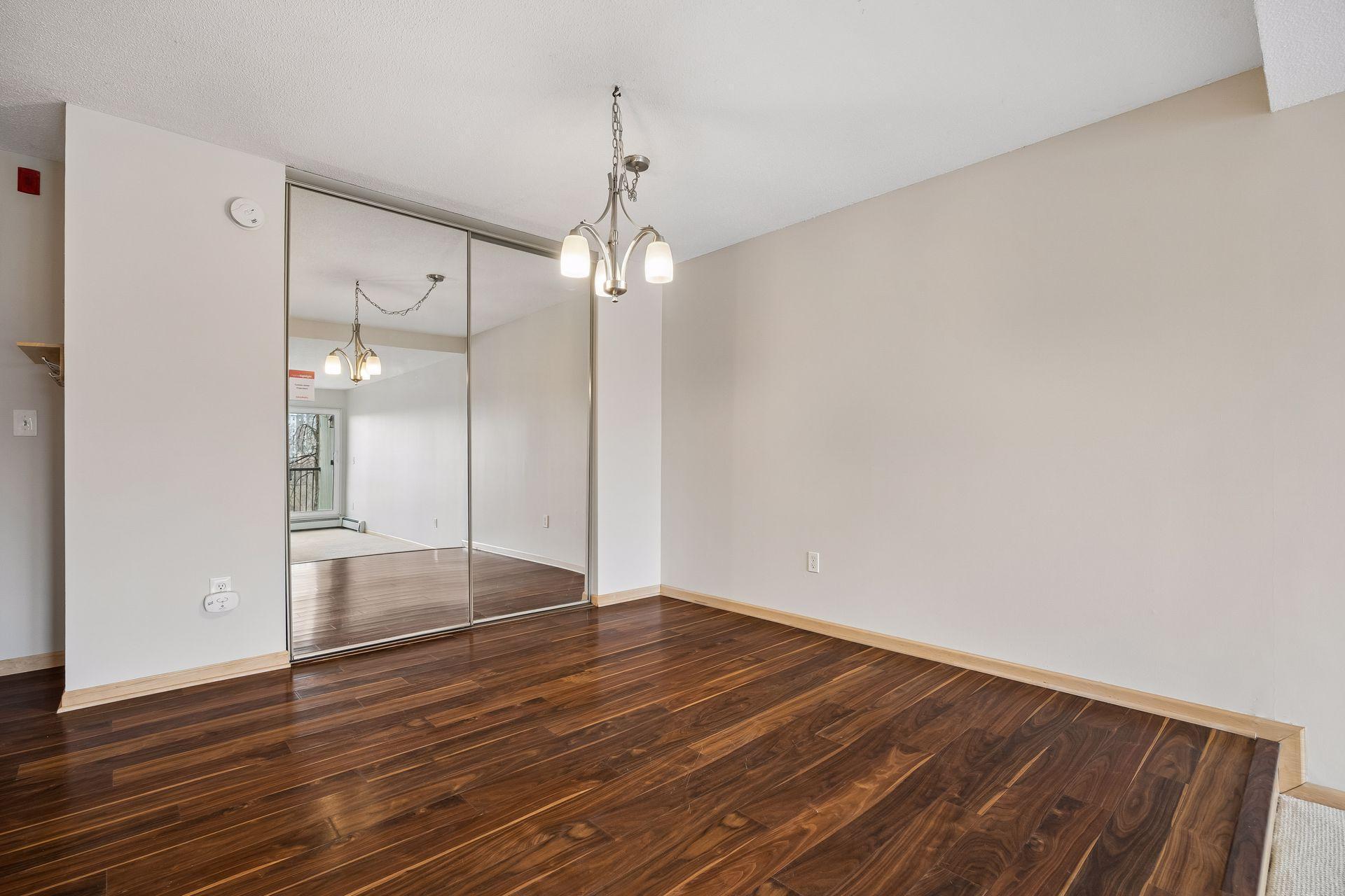 Generous sized Dining area with the mirrors reflecting the light from the living room