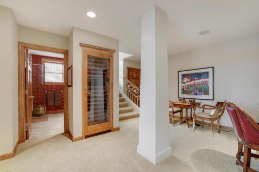 Wine refrigerator adjacent to one of 2 baths on lower level.