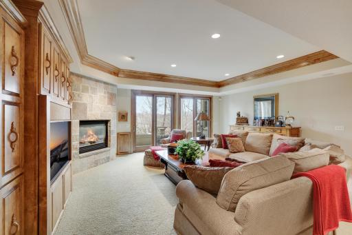 Walkout doors to multi level deck that leads down to Koi pond with patio.