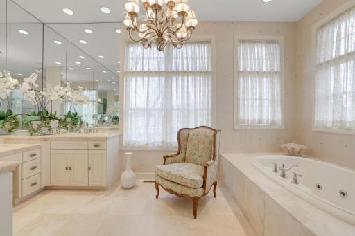 Spacious bath with double vanities and whirlpool tub.