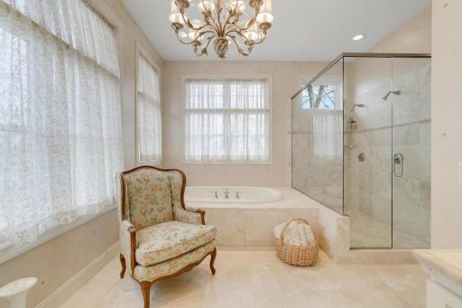 16x13 bath with heated floors, whirlpool, double head shower, double vanity and mirrored walkin closets including a safe.