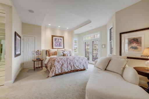 Master suite with access to private deck and staircase to an eagles nest library.