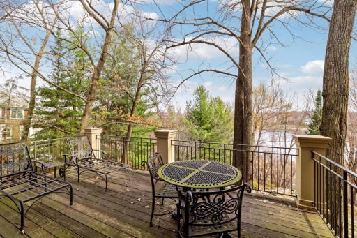 Large deck of bedroom to enjoy your morning coffee overlooking the lake.