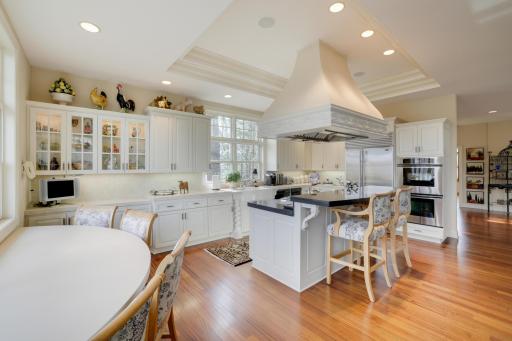 Center island with built breakfast area, Thermadore and Asko appliances.