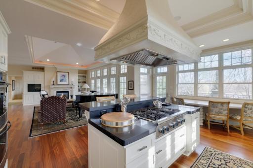 Door from eatin kitchen to deck overlooking the lake and landscaped yard.