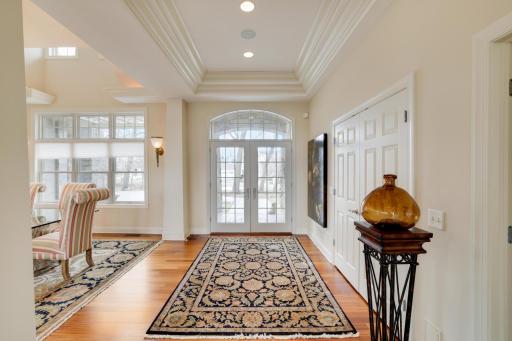 Cherry wood floors from foyer into open great room, dining room and center island kitchen.