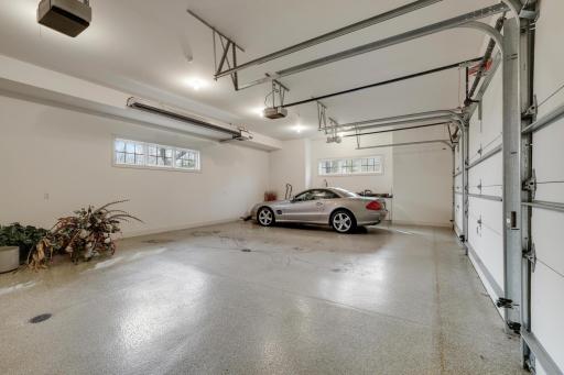 3 car heated garage with epoxy floor and 12 foot ceilings.