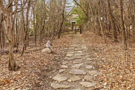 Walkway back up to house and fenced in area.