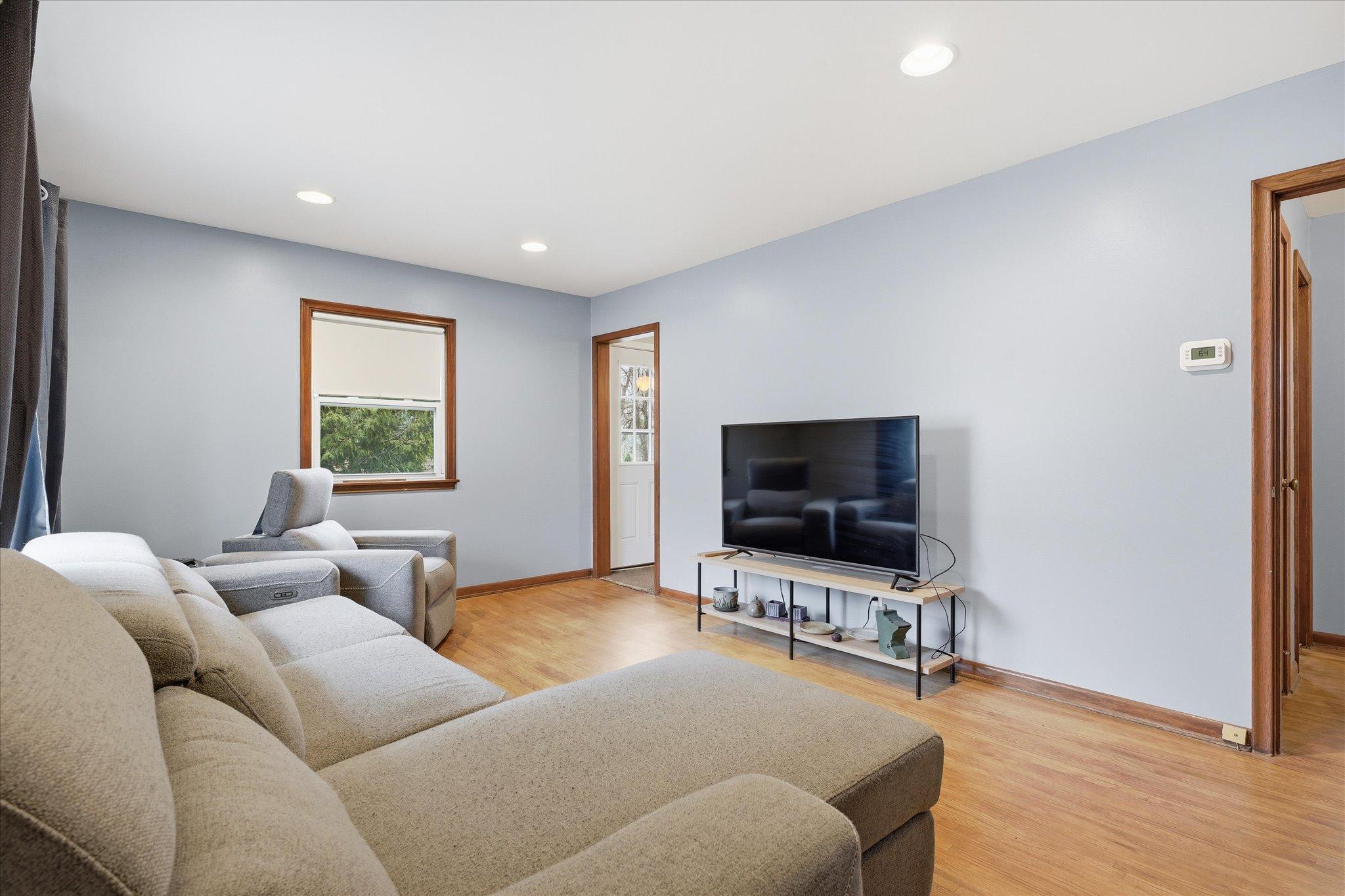 Comfortable living room with clean finishes and easy flow to the rest of the home.