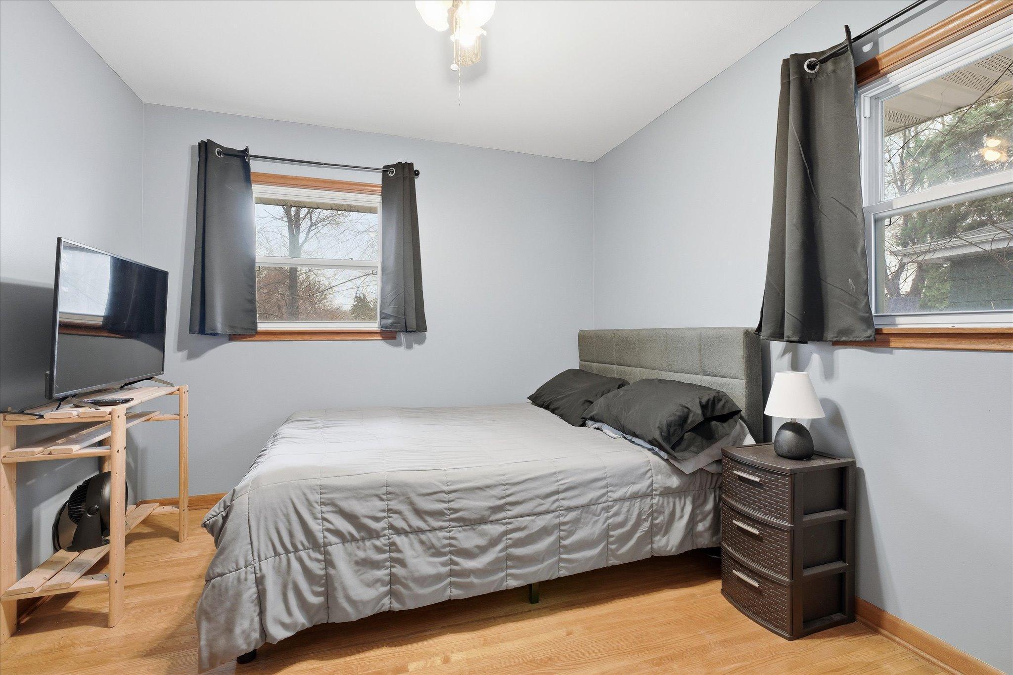 Bedroom #2 has been freshly painted and has hardwood floors, neutral tones, and flexible space for furniture and décor.