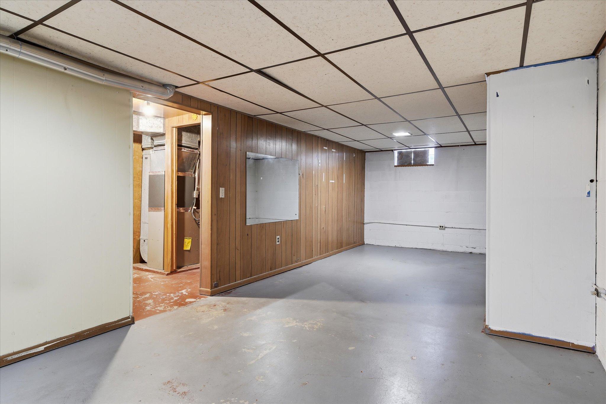 Expansive lower-level space ready to be finished to your liking—ideal for a future family room, game area, or home gym.