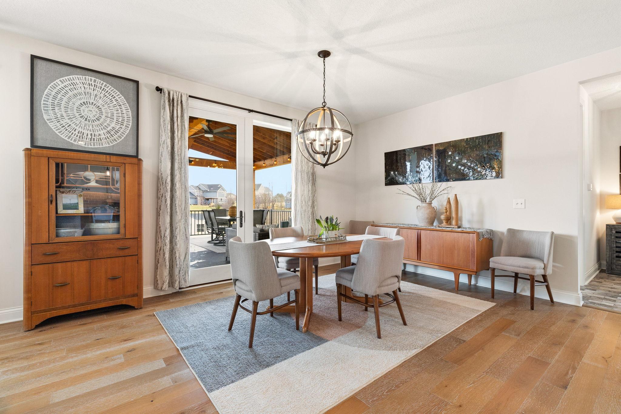 Main level dining room with french doors out to the deck.