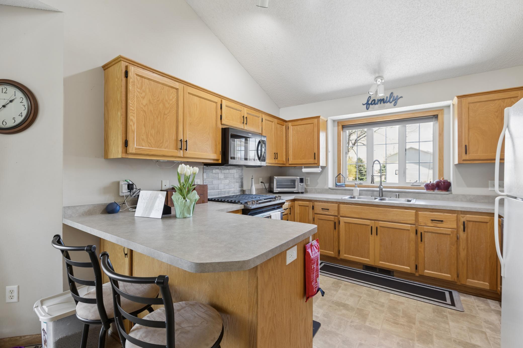 Spacious kitchen with plenty of space for all your cooking needs. Large windows. Nicely done!