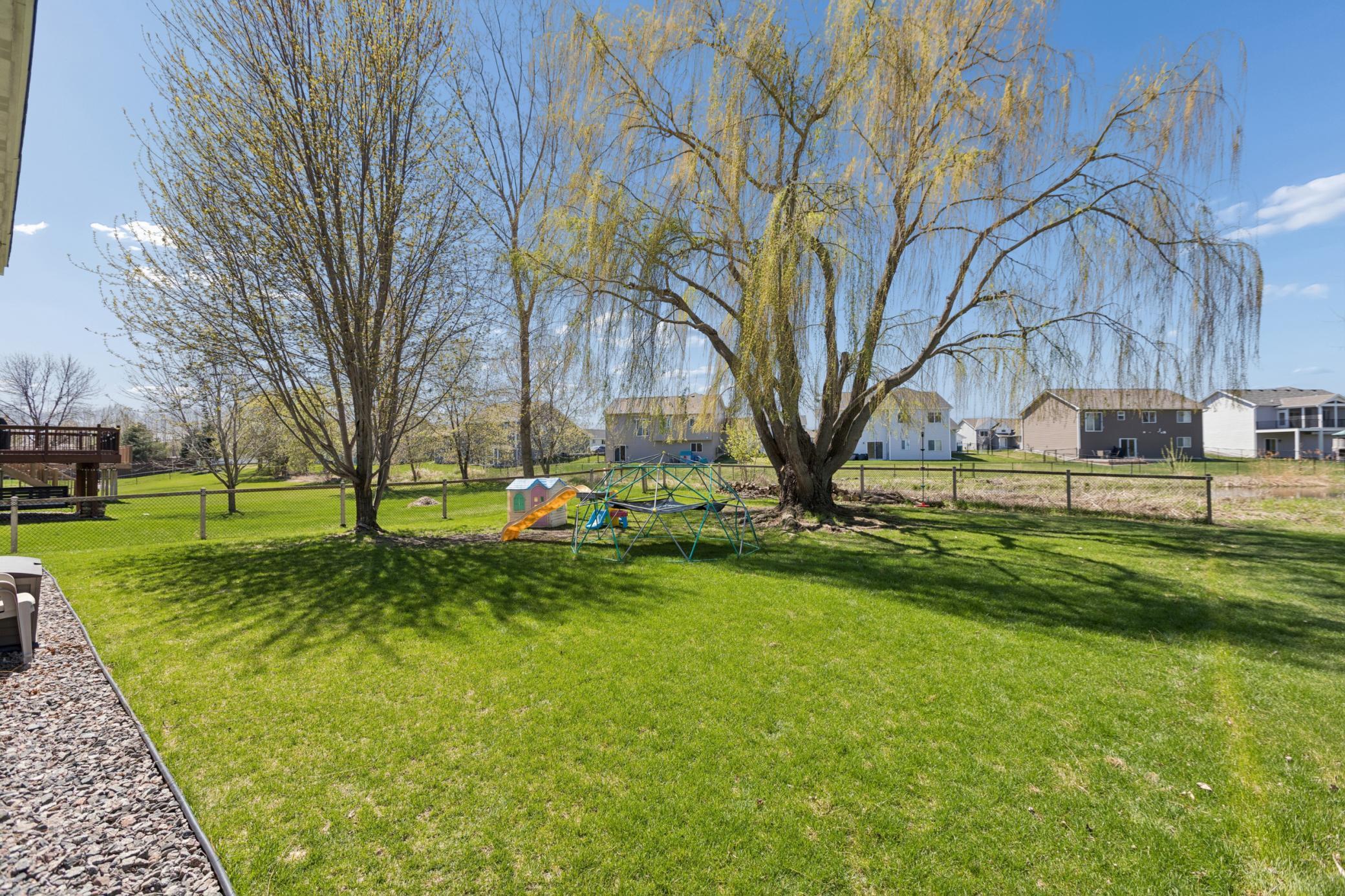 This might be the perfect yard, large and flat. With a large pond in the back.