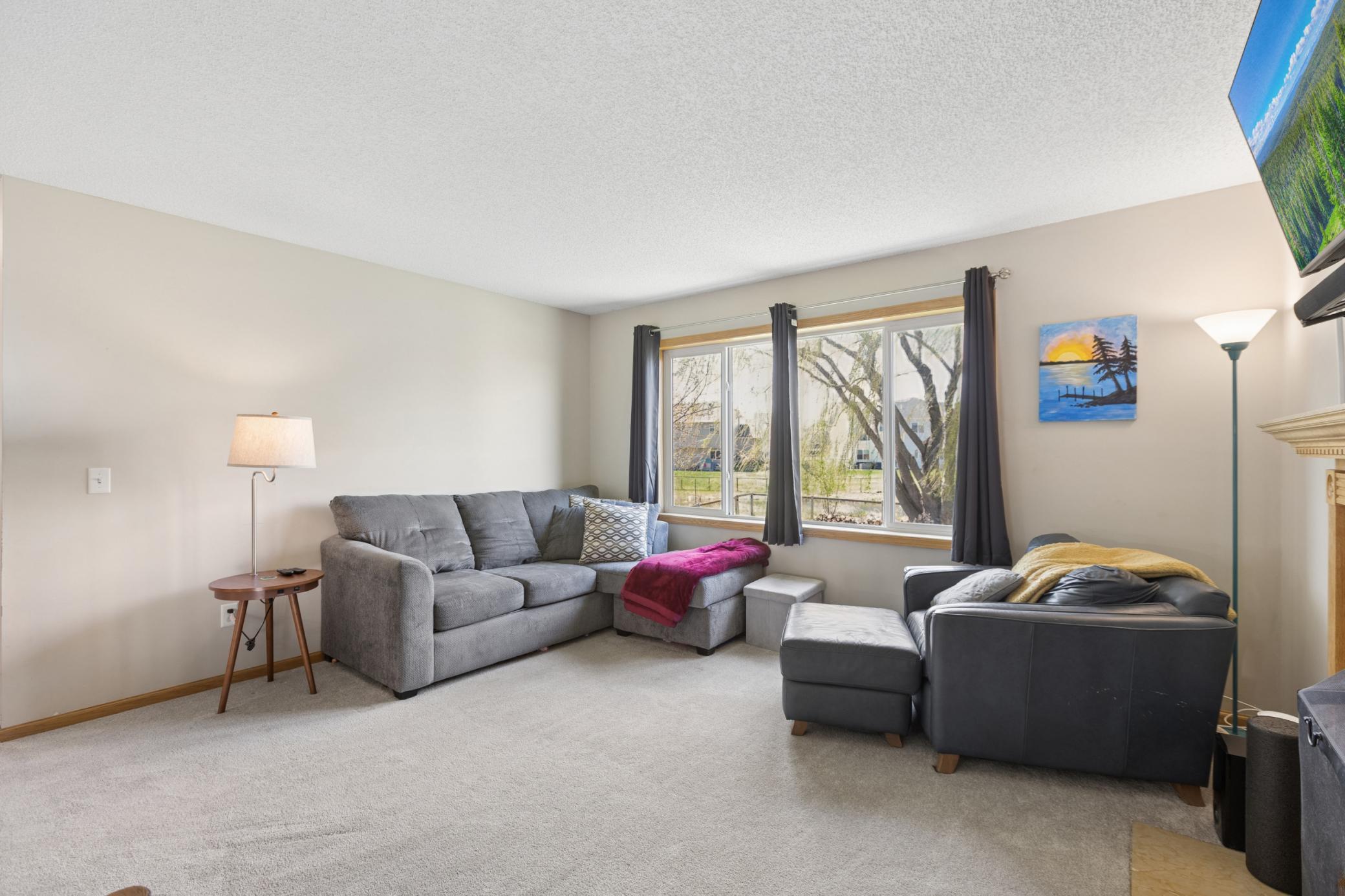 The large windows allow for lots of natural light in the family room and provide great views of the pond and beautiful backyard.