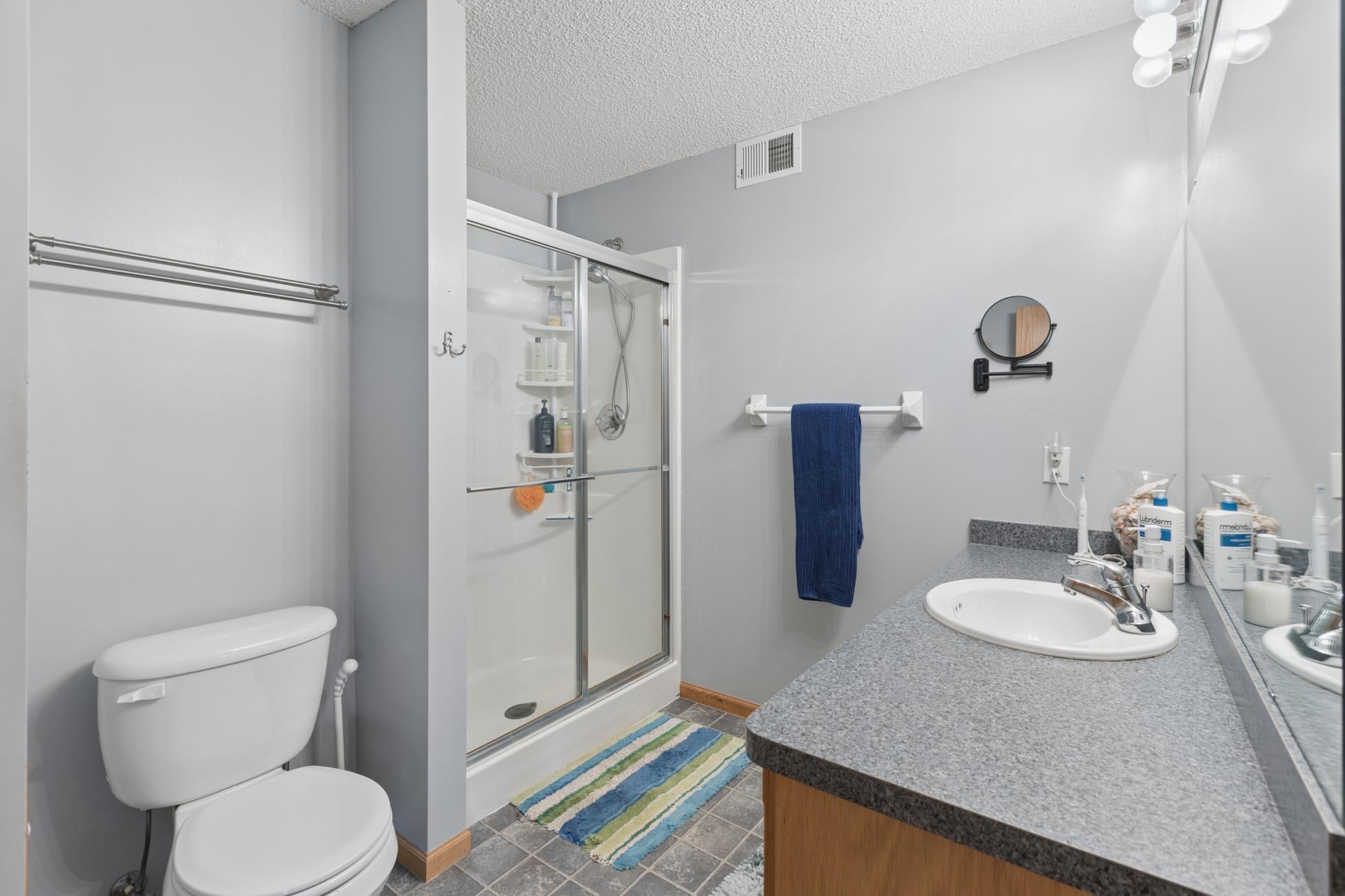 Lower level bathroom perfectly located and tastefully done. Perfect for getting ready for the day.