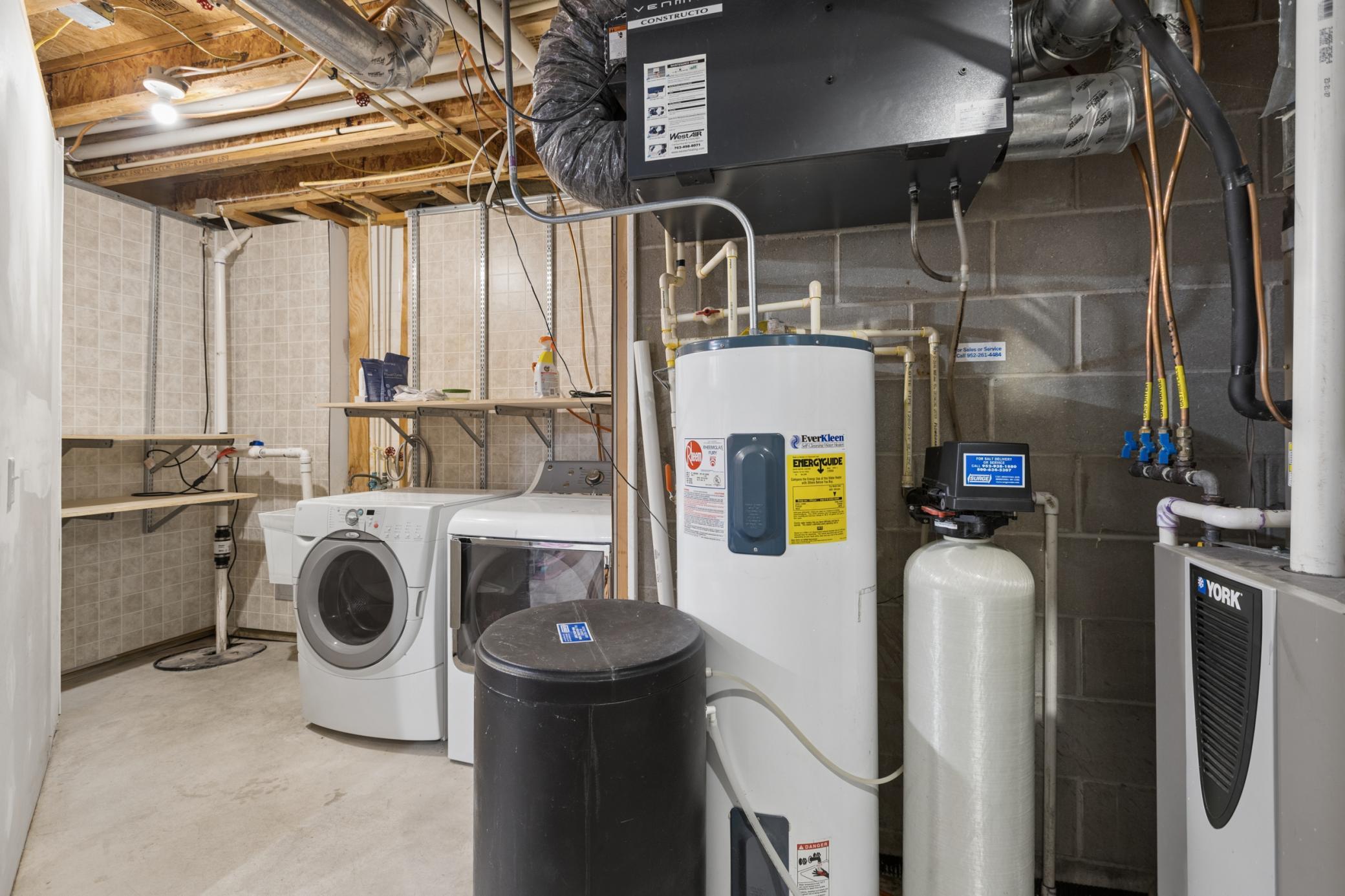 The laundry and utility room located on the lower level.