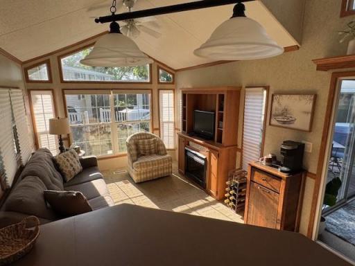 Lots of natural light with all the windows.Notice the Built ins with Fireplace