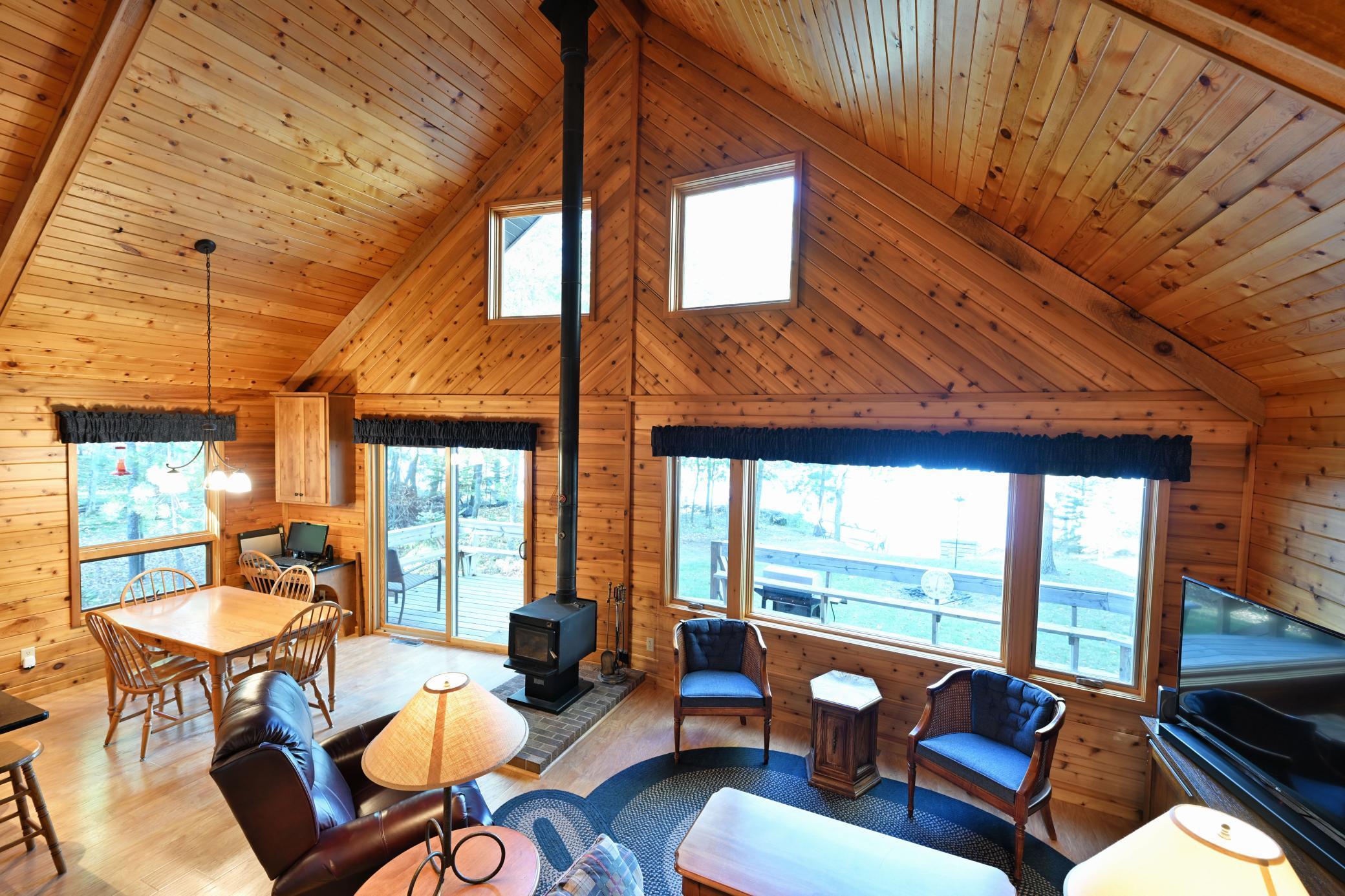 Voluminous open concept main floor is a shared dining and living space.