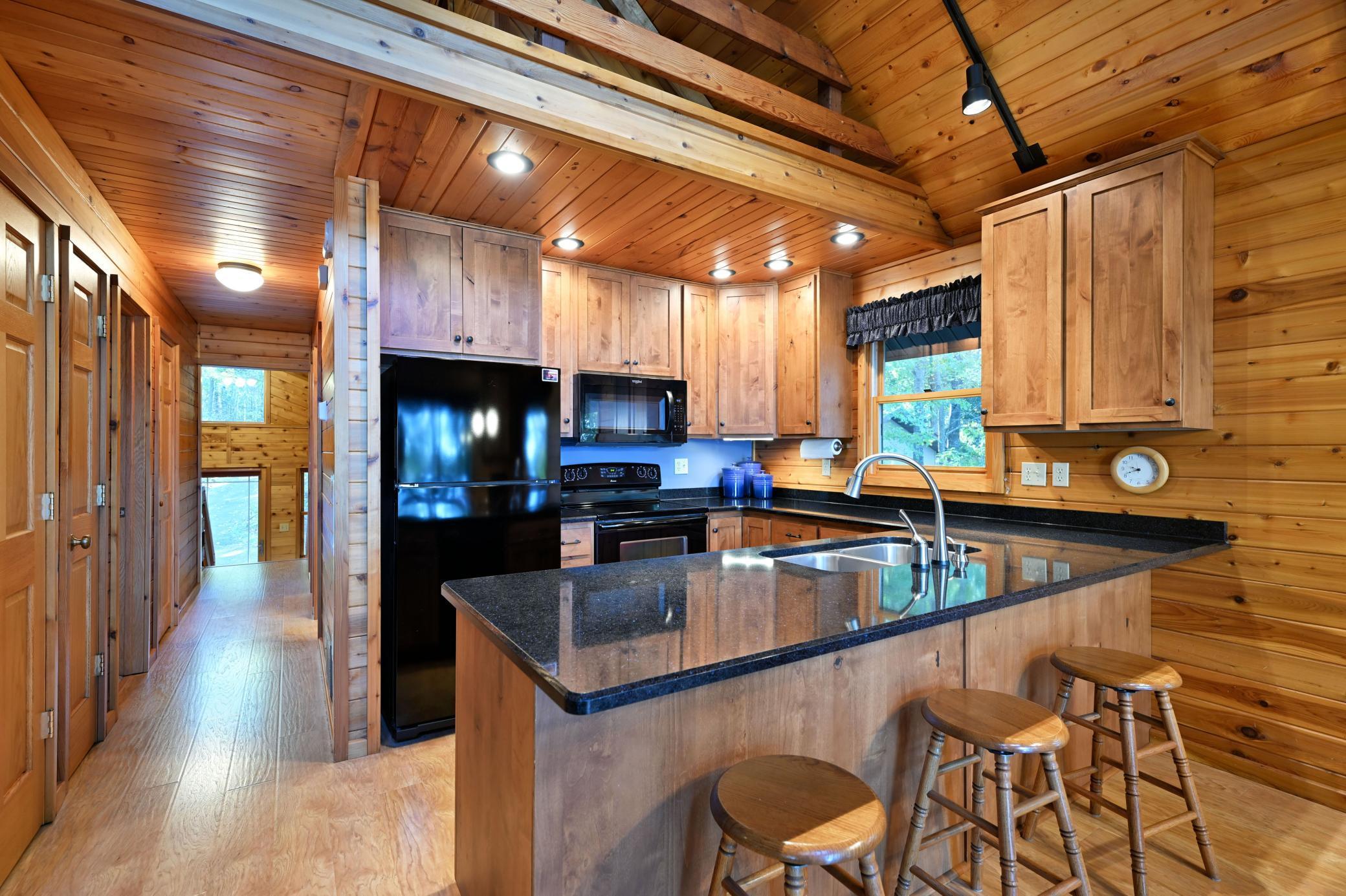 The well-laid out kitchen has abundant cabinetry and countertop space.