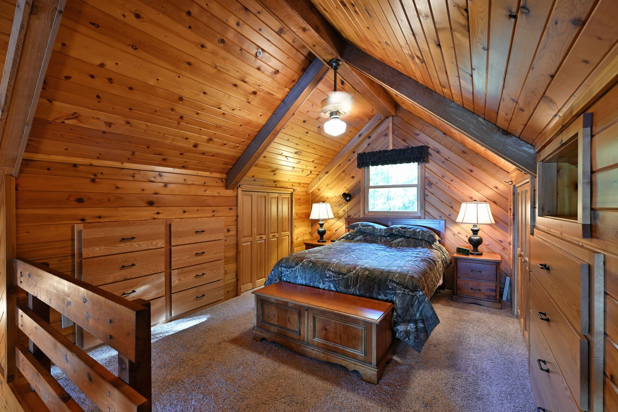 The upper level loft is utilized as the primary bedroom.