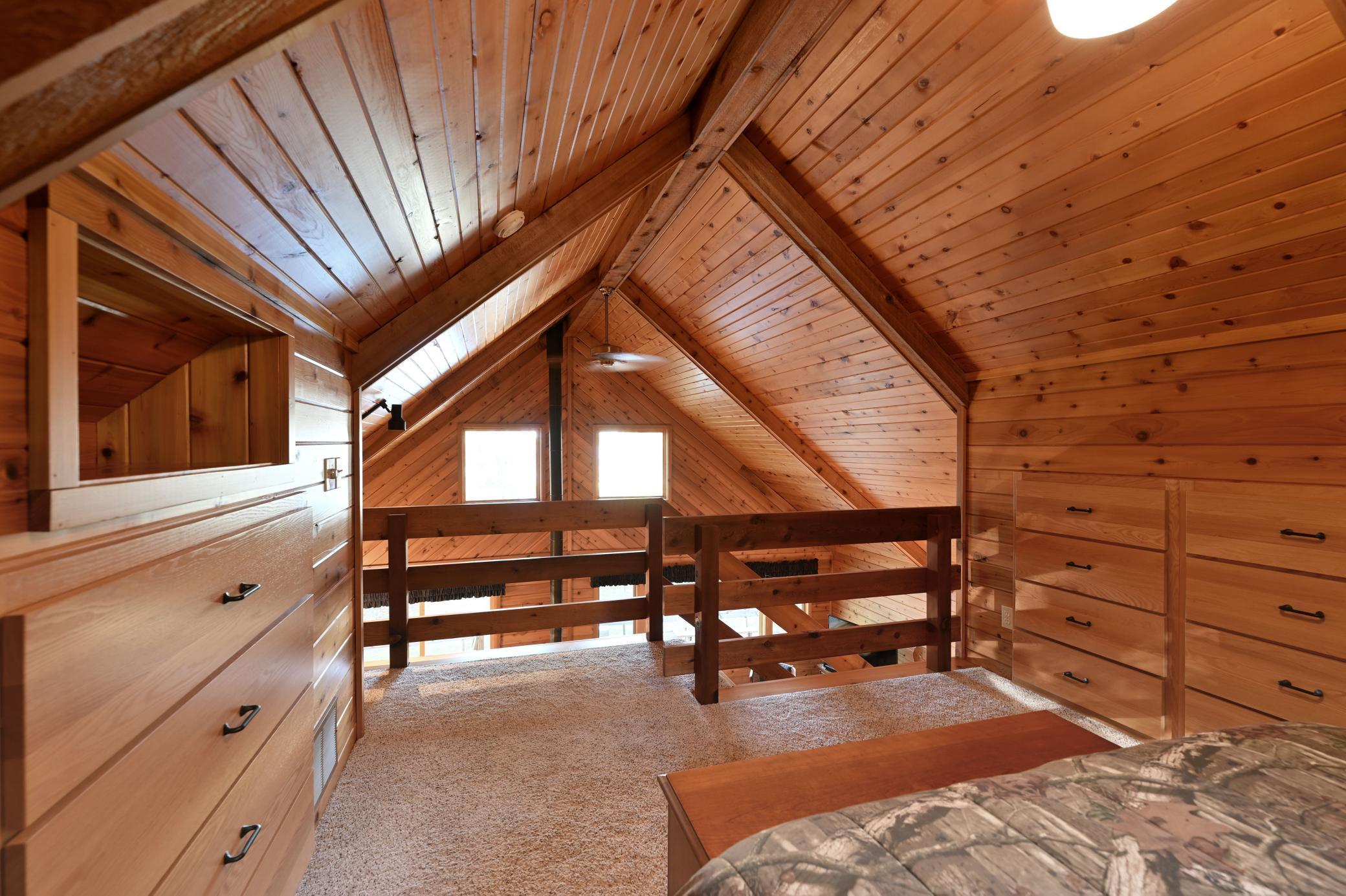 The loft shares west-facing light and is open to the main floor.