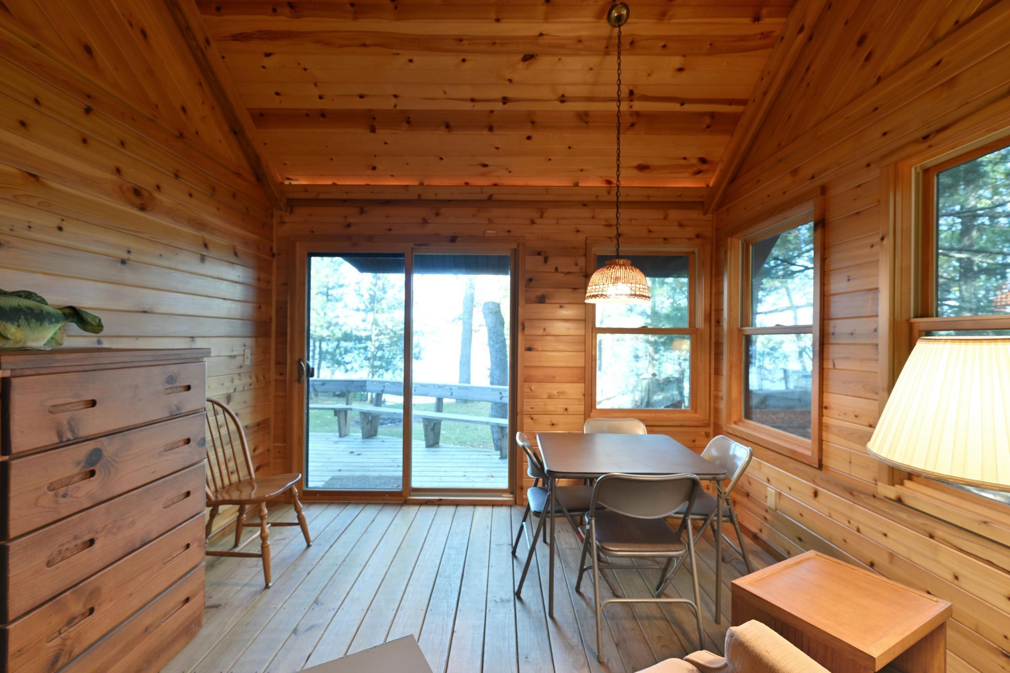 This three-season porch is adjacent to the living room and is a quiet space to escape to.