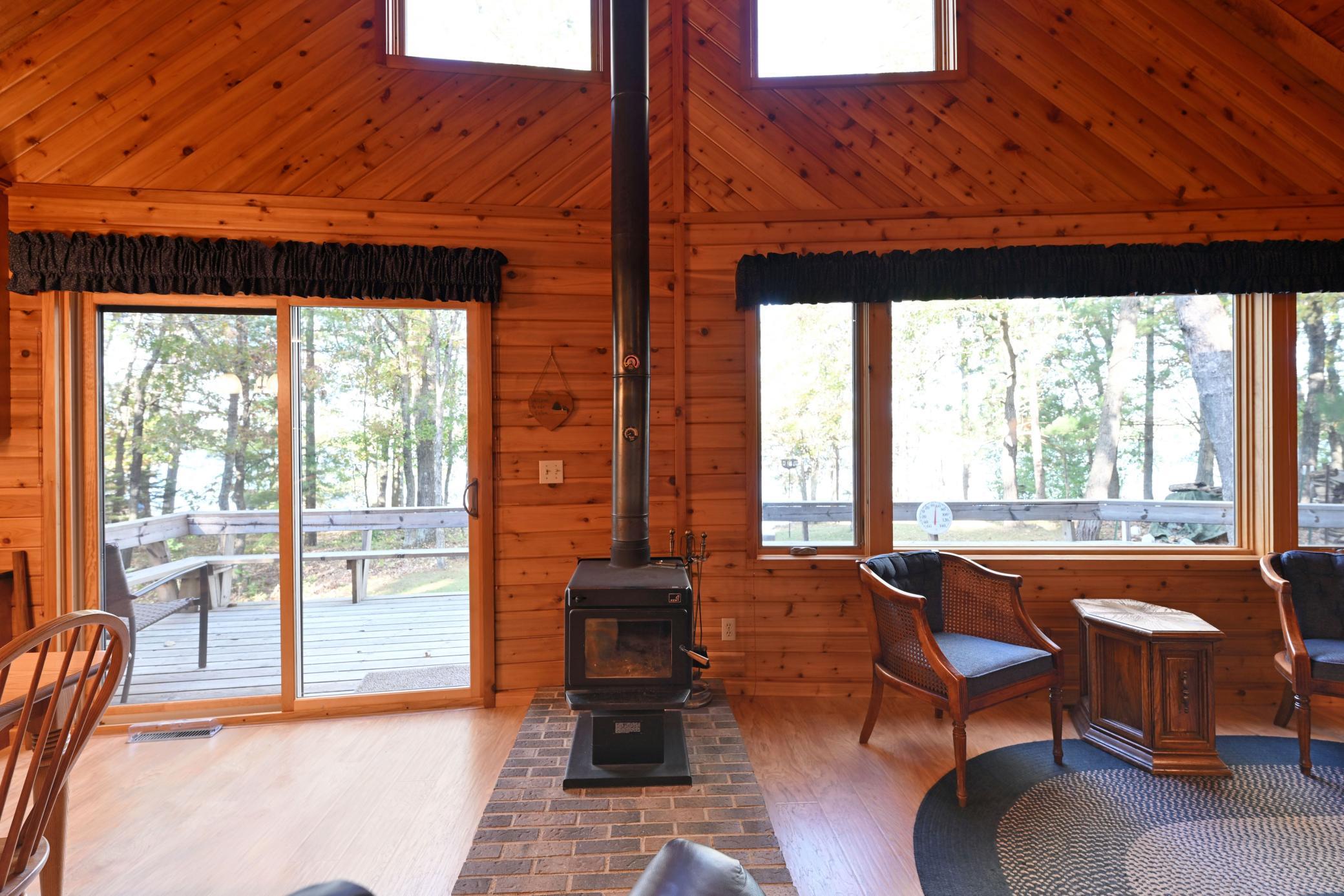 A wood stove provides supplemental heat to the main floor living spaces.