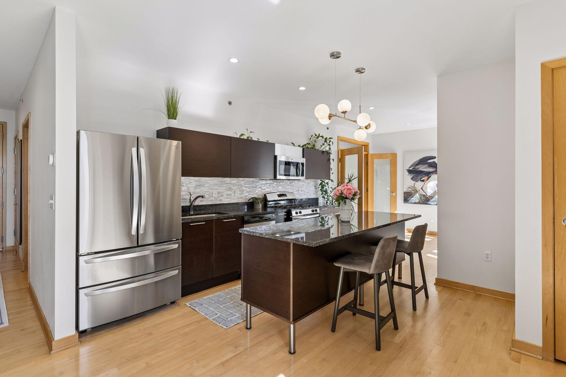 Kitchen updates include a new refrigerator in 2024, brand new garbage disposal, and newly updated lighting.