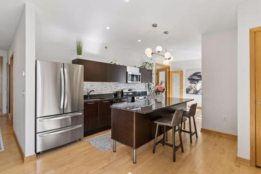 Kitchen updates include a new refrigerator in 2024, brand new garbage disposal, and newly updated lighting.