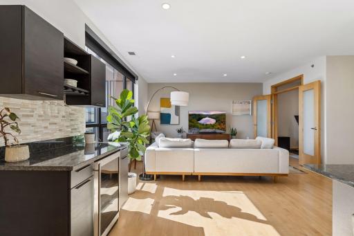 Additional storage space with the built-in bar and mini-fridge.