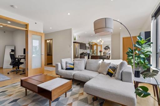 Open concept layout between kitchen, dining and living room.