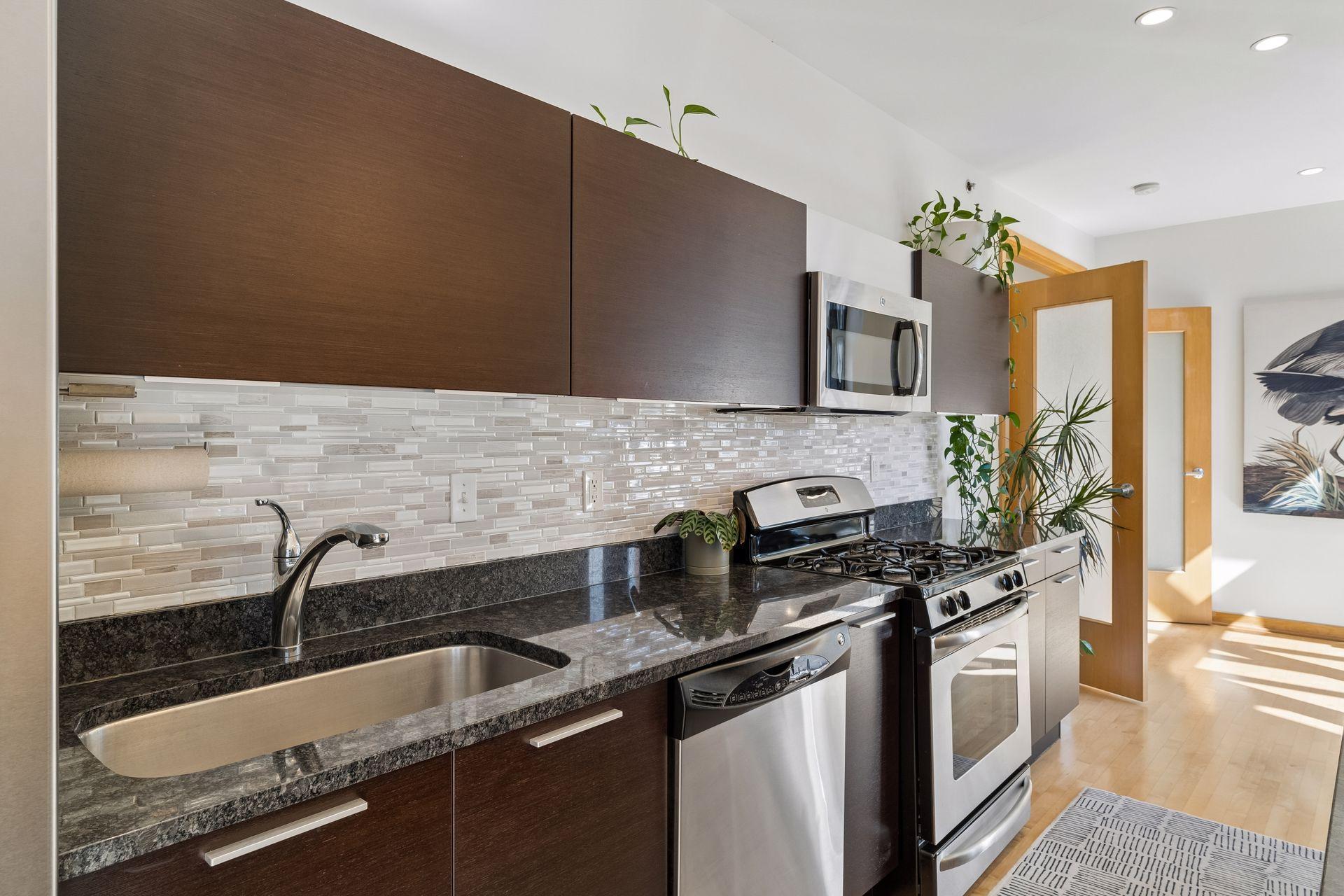 Beautiful granite countertops and gas range stove.