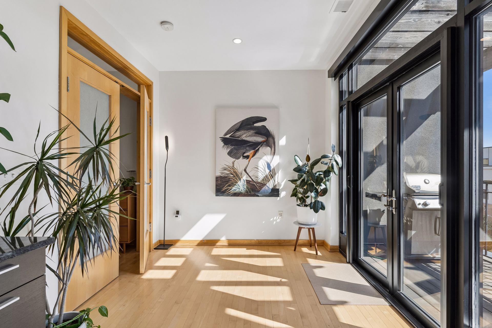 Space off the primary bedroom is perfect for informal dining, a den, or study area.