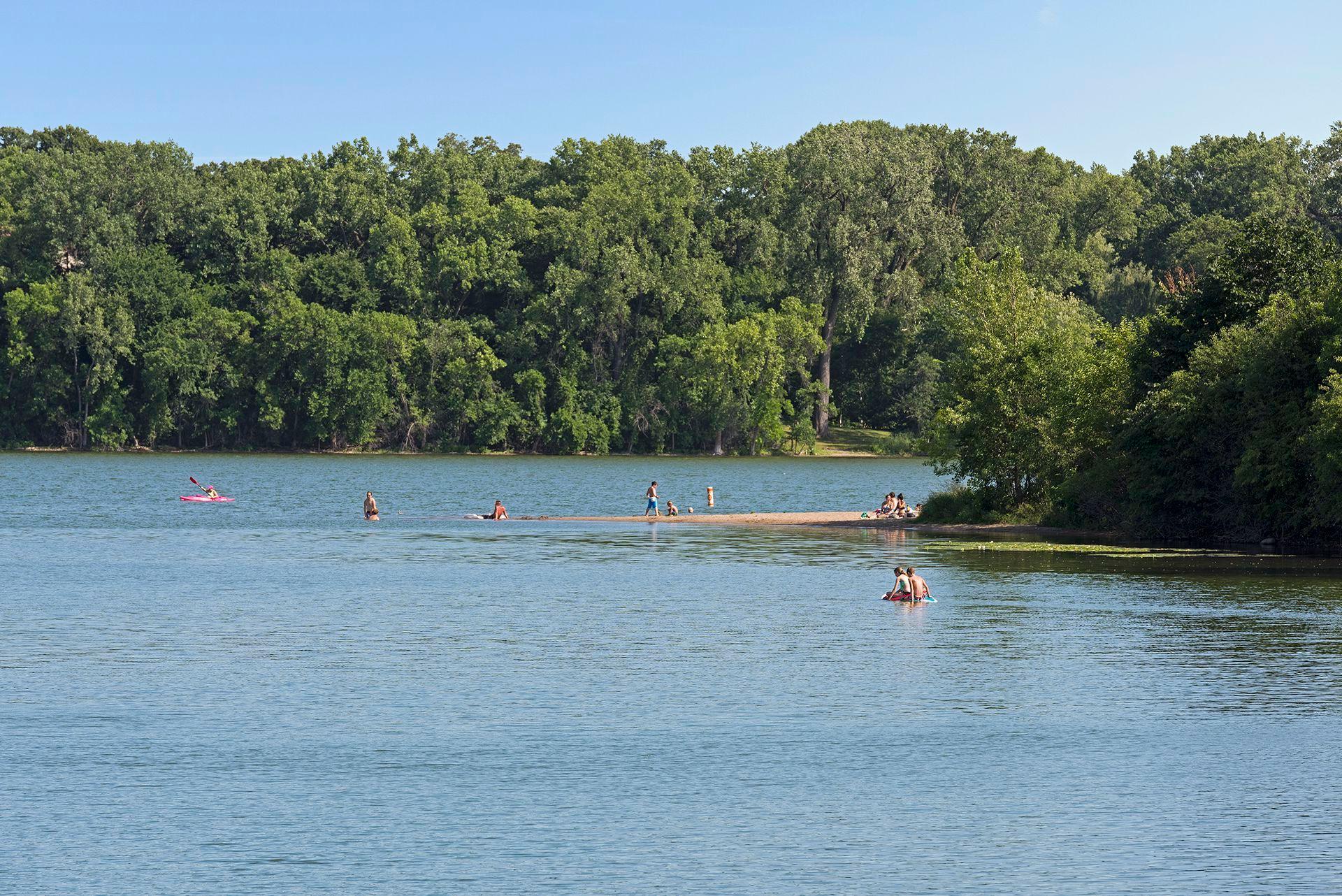 "The tree-lined shores of Cedar Lake give way to three sandy beaches and is easily accessible"