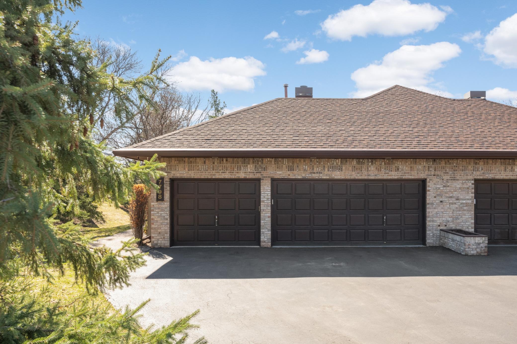 Rare 3 car garage that is finished, heated and has a pulldown stairs to storage above.