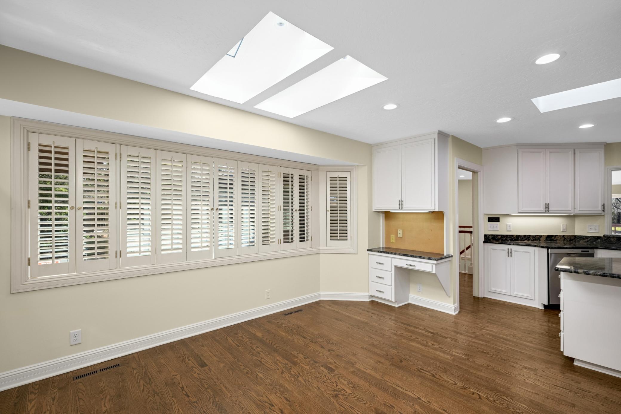 This dining area is often partially used as a sitting area near the fireplace.