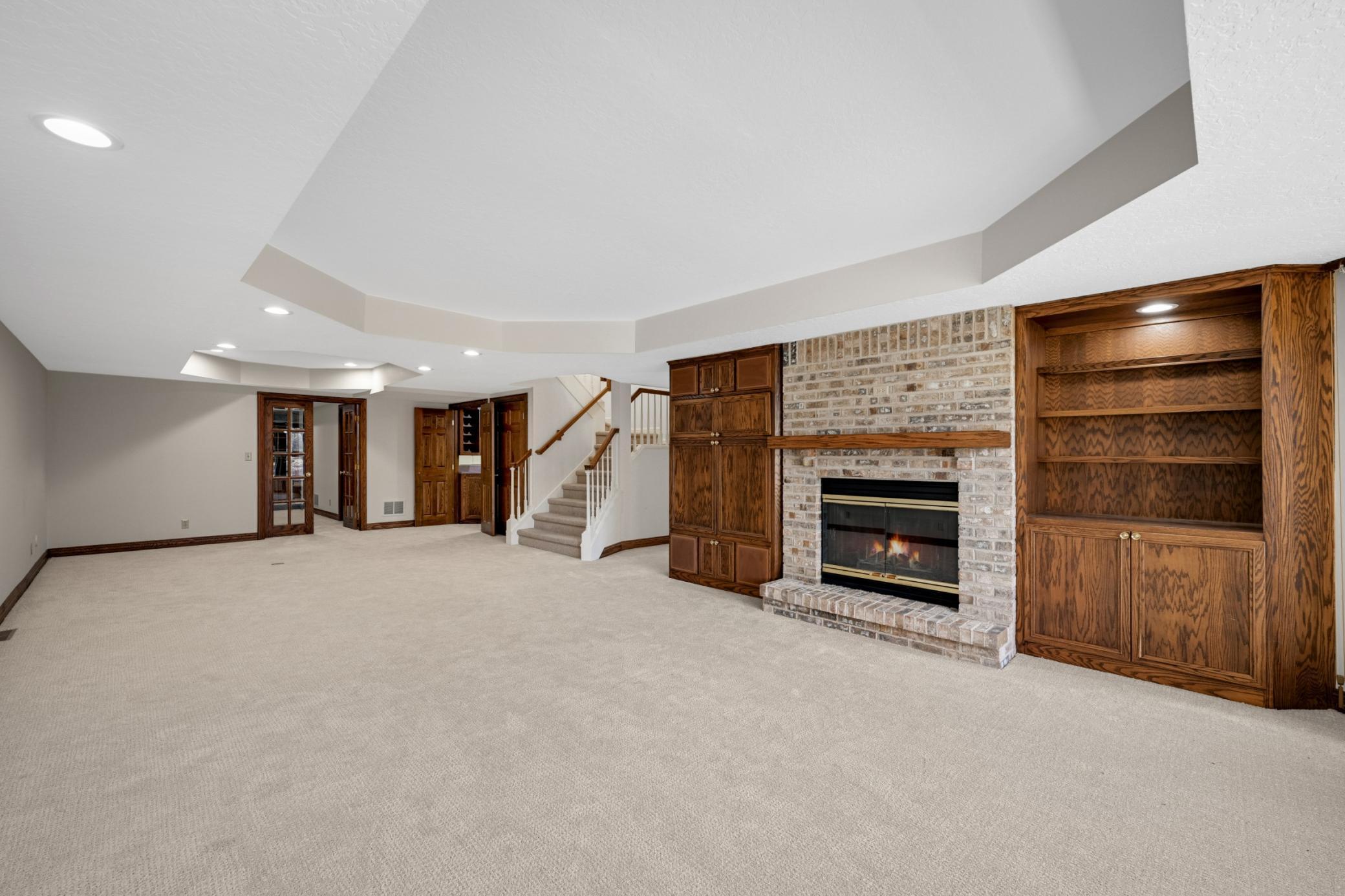A spacious game area or billiards area on the far side of this room.
