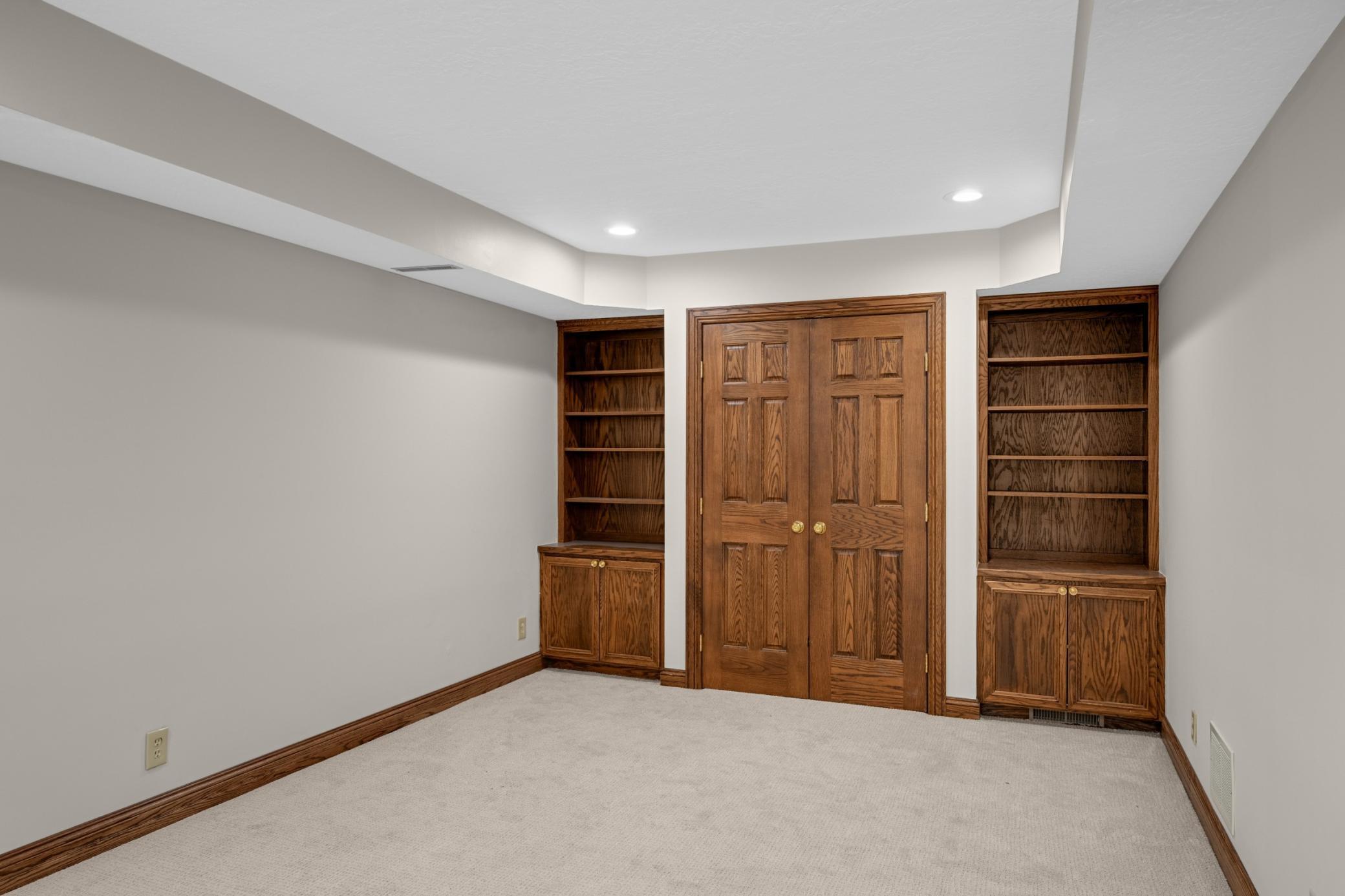 French doors open to an office/ exercise room / 4th Bedroom with a closet and built-ins.