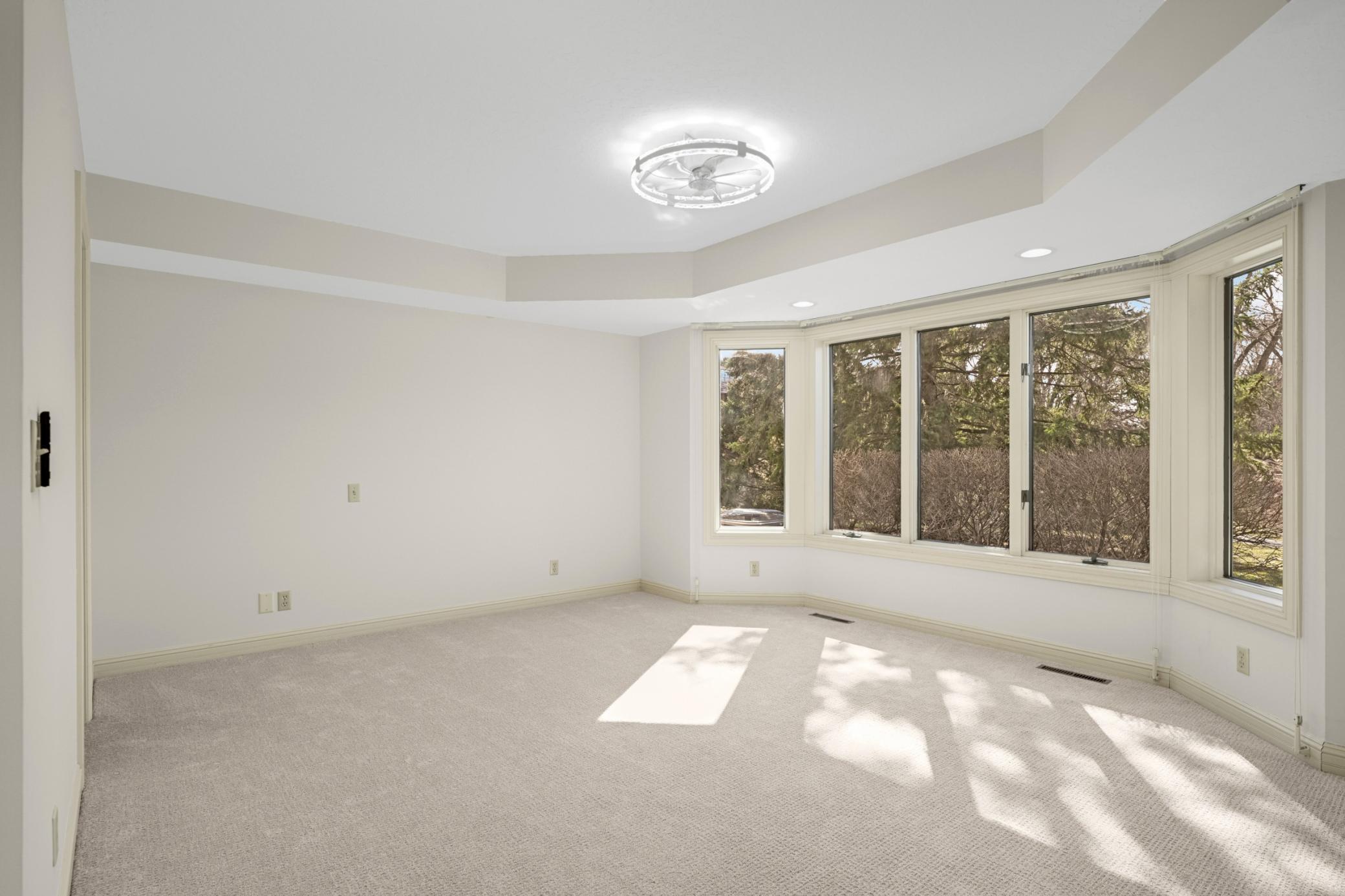 The 2nd bedroom has a a bay window overlooking the pond.