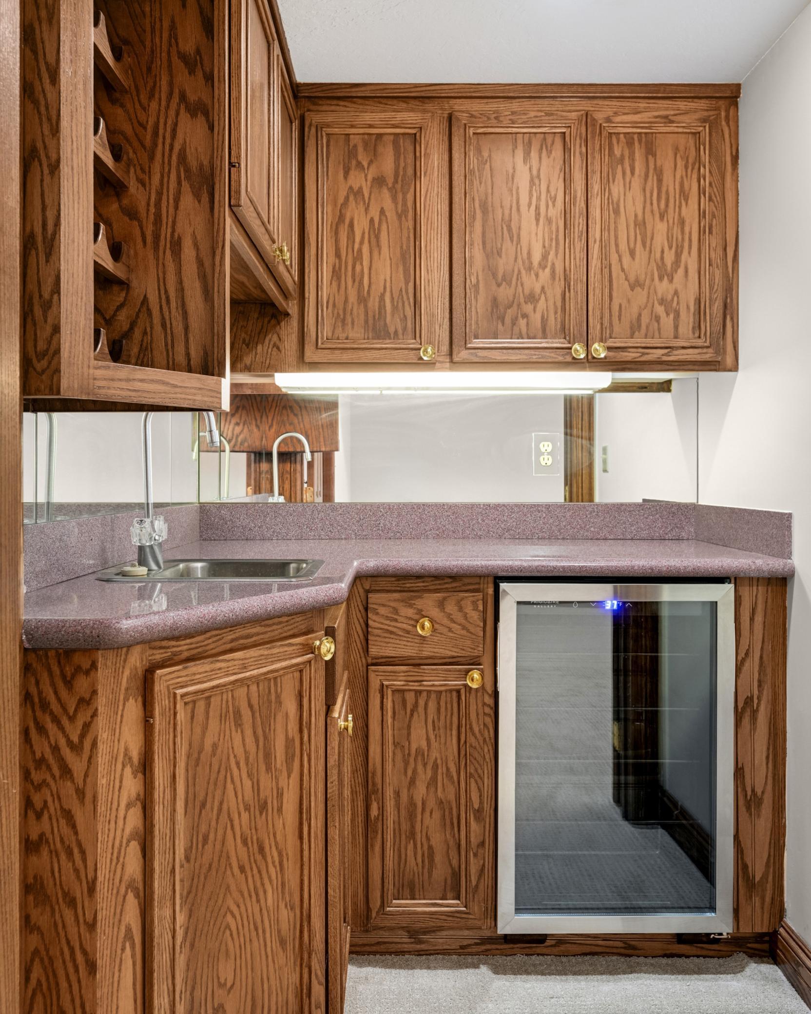 The is a convenient wet bar room with a new wine/beverage refrigerator.