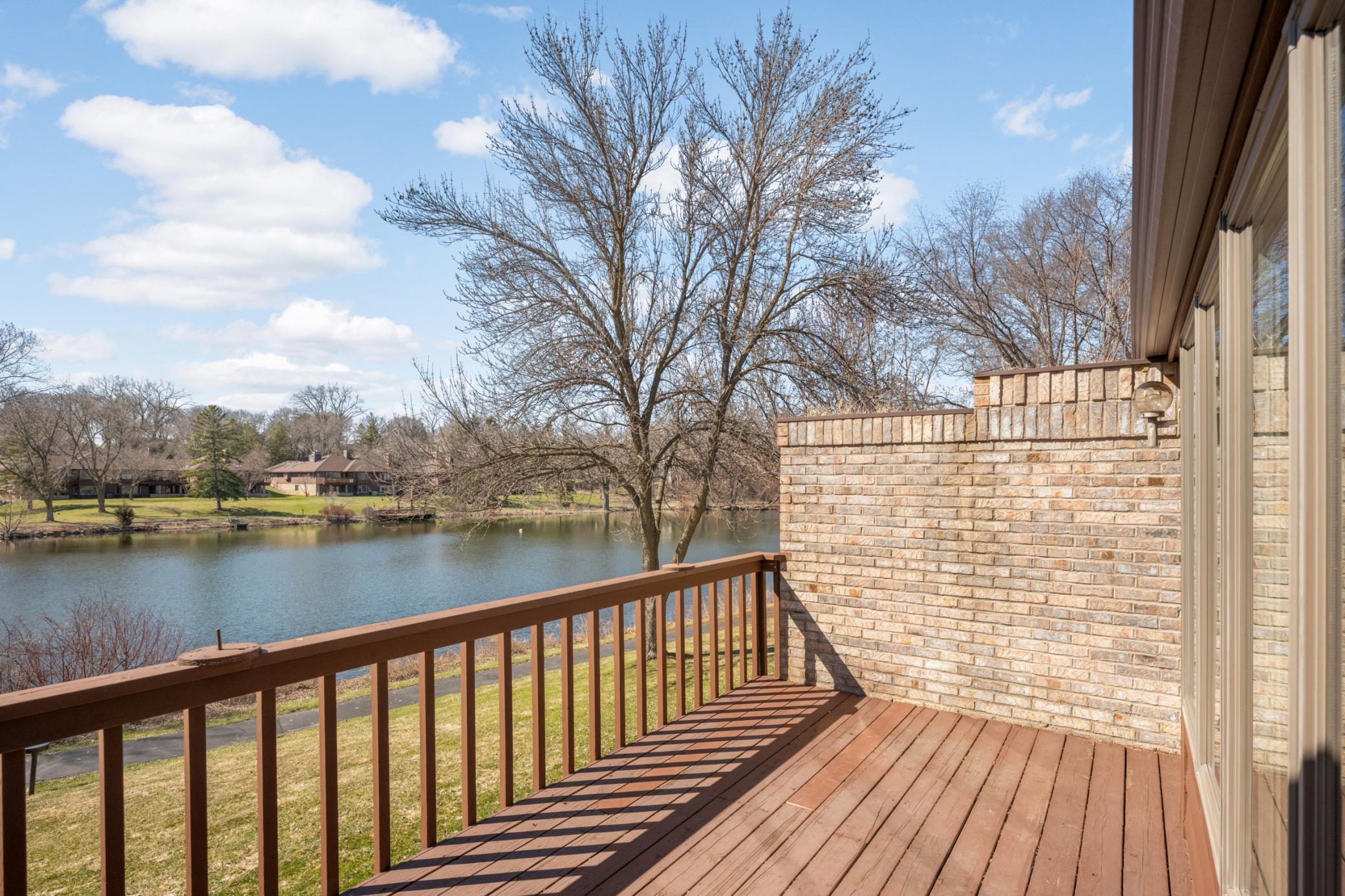 The private main floor deck overlooks the pond.