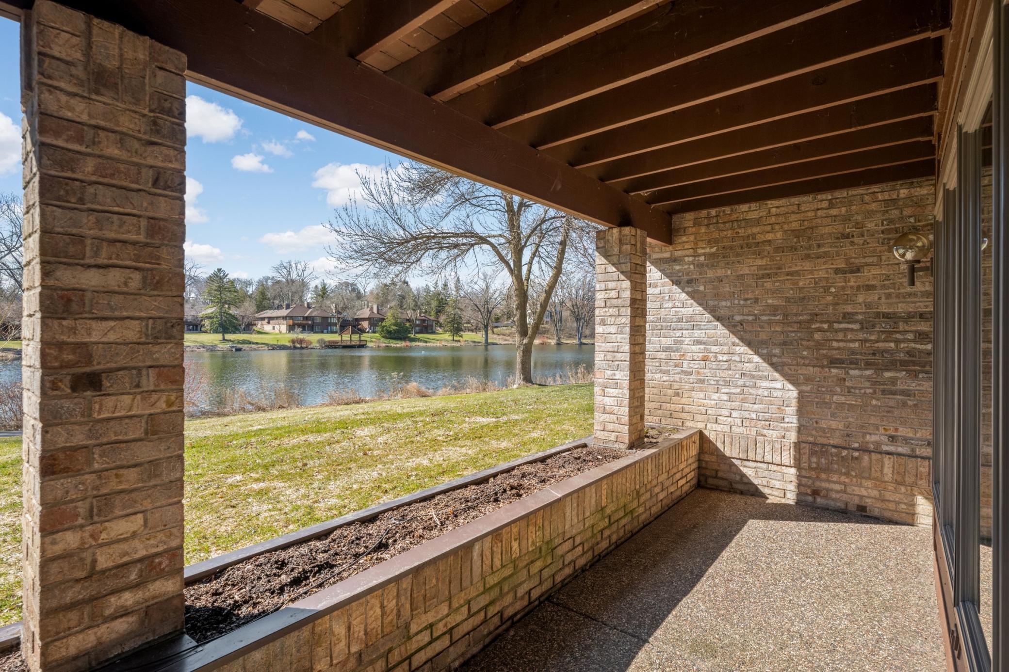 The walkout level has a patio has planters that are planted by the association and has a sprinkler system to it.