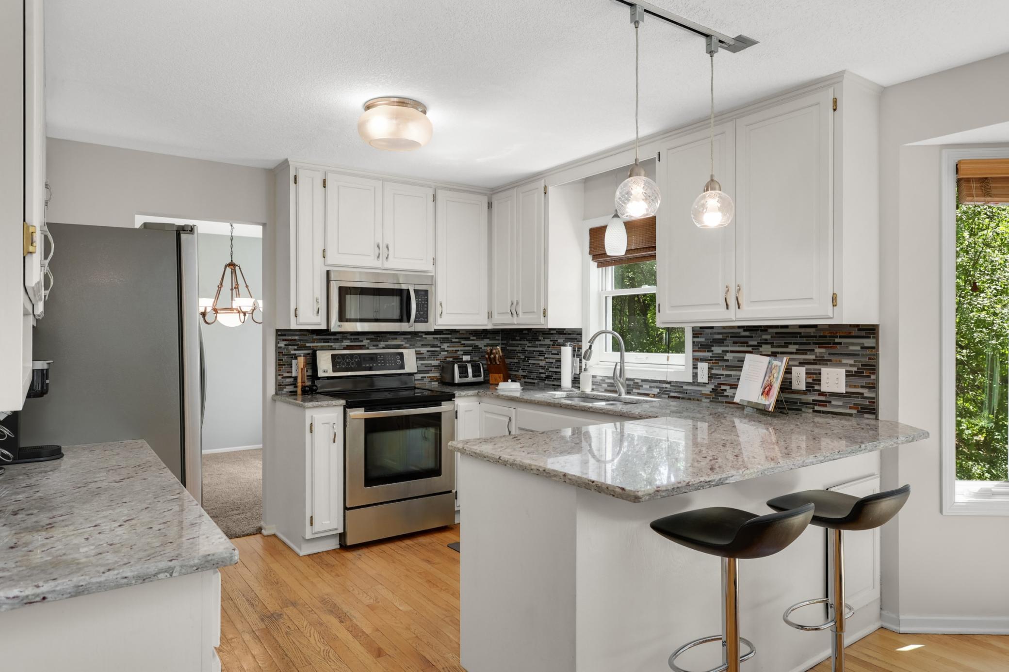 Light and bright kitchen with granite counters