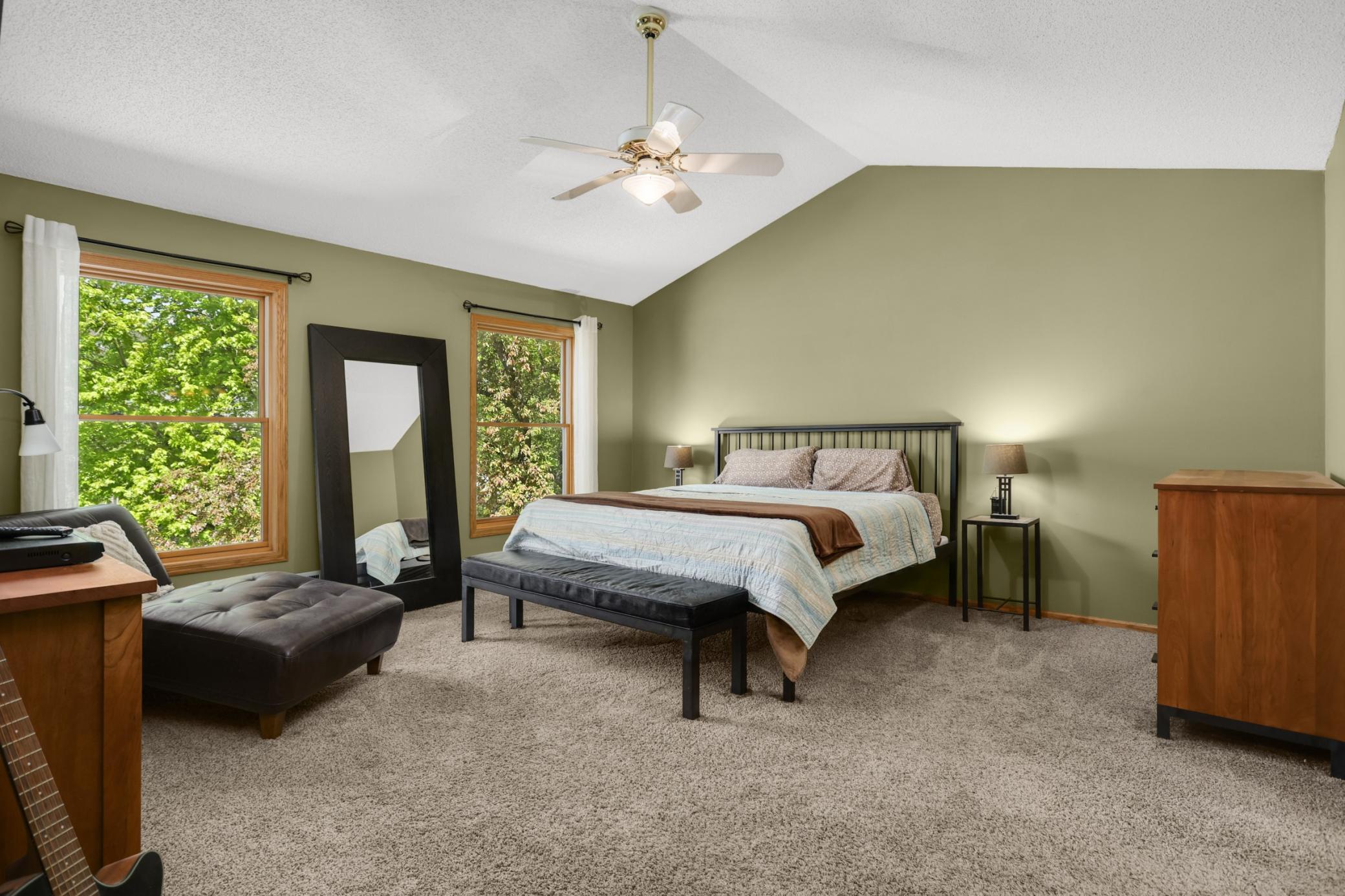 Spacious primary suite with vaulted ceilings
