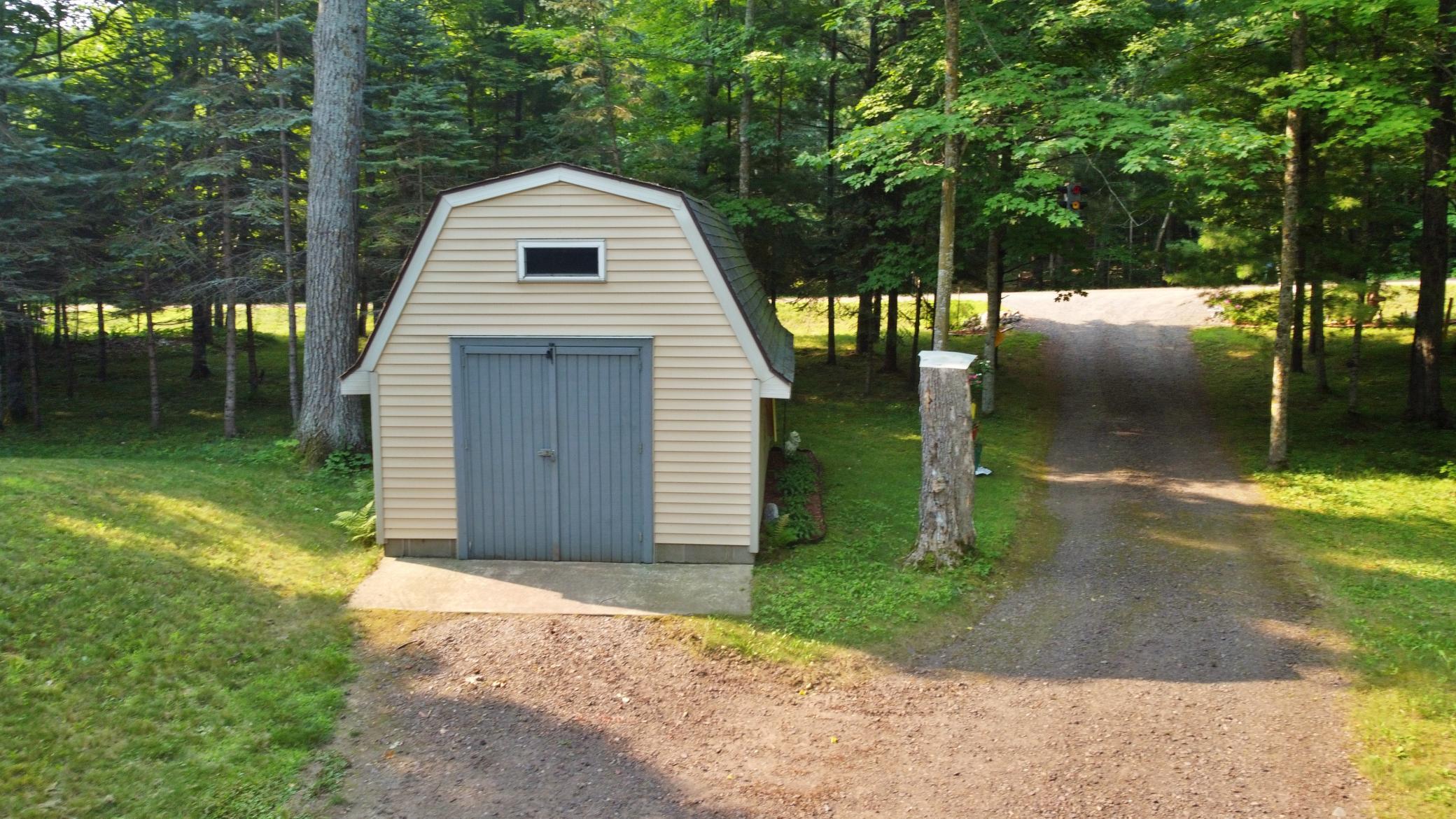 12x16 storage shed at property entrance