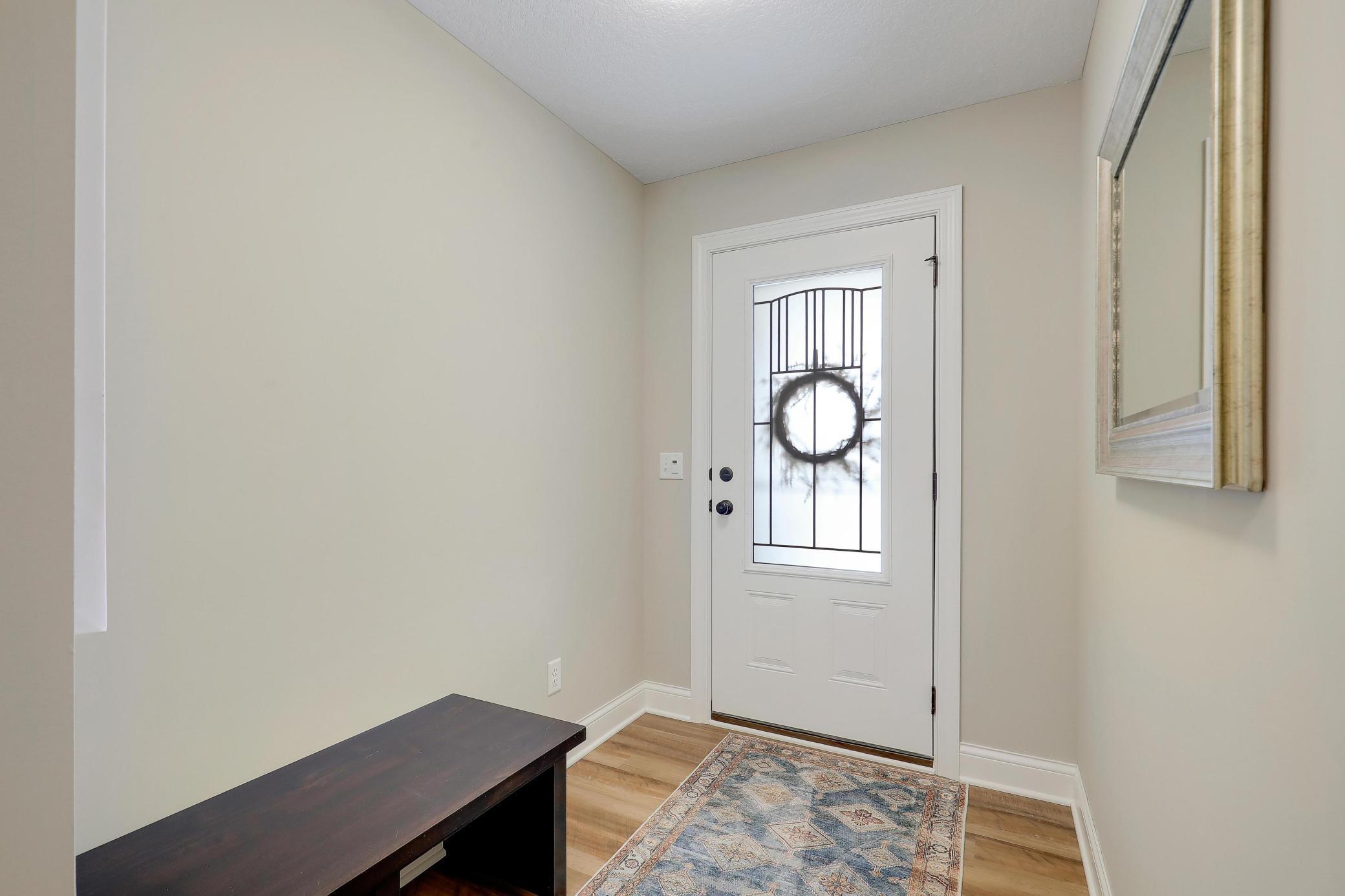 Roomy foyer with built in bench